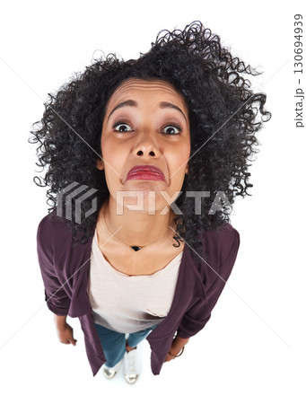 Sad, face and woman overhead disappointed and feeling unhappy isolated against a studio white background. Portrait, top view and frustrated young person is moody, annoyed or in fear due to fail 130694939