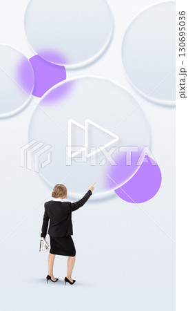 Businesswoman pointing at giant digital fast forward icon in futuristic collage 130695036