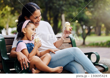 Summer, park and ice cream with a mother and girl bonding together while sitting on a bench outdoor in nature. Black family, children and garden with a woman and daughter enjoying a sweet snack Summer, park and ice cream with a mother and girl bonding together while sitting on a bench outdoor in nature. Black family, children and garden with a woman and daughter enjoying a sweet snack 130695424