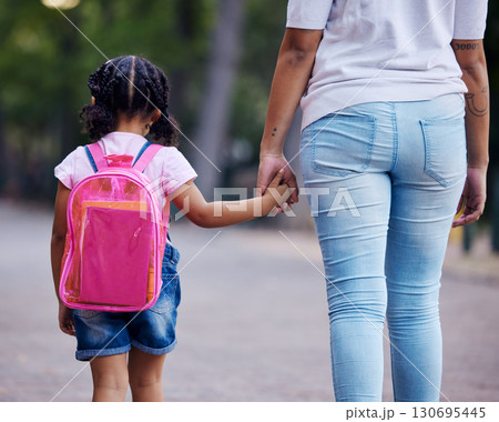 Holding hands, mom and child walking to school, help and care with support outdoor, education and growth. Kindergarten, development in childhood and backpack, family, woman with girl in the morning 130695445