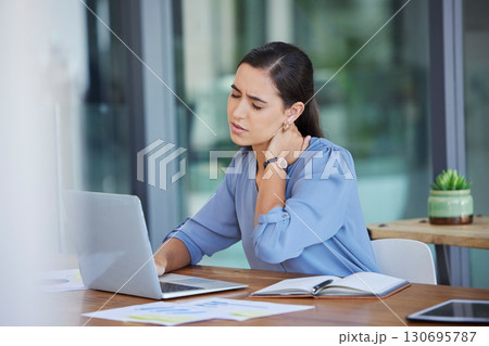 Stress, neck pain and business woman on laptop at office desk with joint injury risk. Tired worker, burnout and body fatigue while working on computer with anxiety, muscle problem or poor posture 130695787