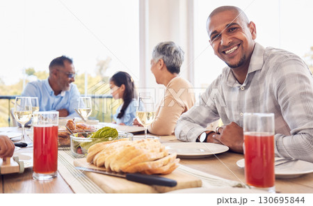 Food, portrait and man at happy family brunch, lunch and celebration event for reunion, bonding and enjoy quality time together. Love smile, happiness and group of people eating meal at Mexico home 130695844