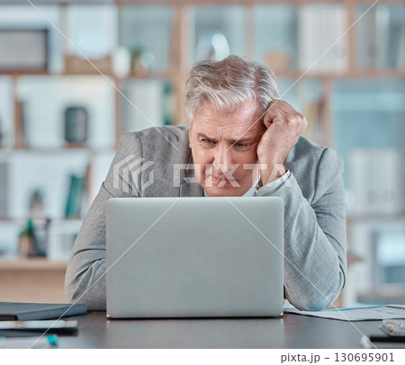 Stress, confused and mature businessman with a laptop, reading an email and tired from a deadline. Anxiety, burnout and elderly corporate worker with bad news, glitch or problem with a computer 130695901