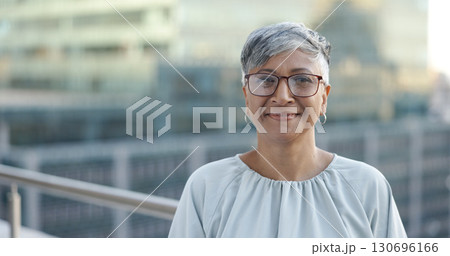 Portrait, mature and happy woman on office building balcony with confidence, pride or business entrepreneur. City, terrace or proud businesswoman with smile on face at consulting startup on cityscape 130696166