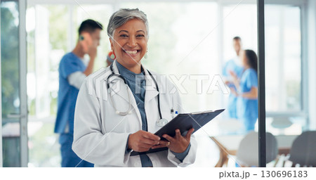 Senior woman, portrait and doctor in healthcare, career ambition or documents for advice at hospital. Happy mature female person or medical professional smile with clipboard in leadership at clinic Senior woman, portrait and doctor in healthcare, career ambition or documents for advice at hospital. Happy mature female person or medical professional smile with clipboard in leadership at clinic 130696183
