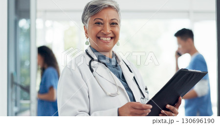 Senior woman, portrait smile and doctor in healthcare, career ambition or documents at hospital. Happy mature female person, medical professional or manager with clipboard in leadership at clinic Senior woman, portrait smile and doctor in healthcare, career ambition or documents at hospital. Happy mature female person, medical professional or manager with clipboard in leadership at clinic 130696190