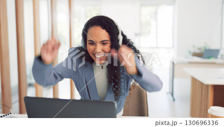 Laptop, video call and a winner business woman in her office with a reaction to the good news of a bonus or promotion. Computer, success and virtual meeting with an excited young employee at work 130696336