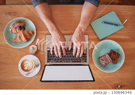 Laptop, coffee shop and above man hands writing email, freelance and internet with screen mockup. Hand, remote work and social media influencer in cafe for food, review or typing blog, search or web 130696349