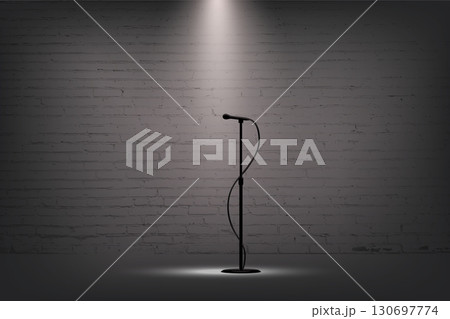 Microphone and spotlight on empty stage. Black mic stand under white lights in front of brick wall for music performance, podcast, comedy or singing contest. Realistic vector illustration 130697774