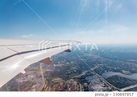 View from the airplane window during taking off on a clear summer morning 130697857