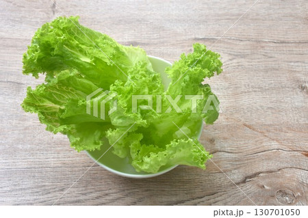 fresh green lettuce vegetable salad with drop of water arranging on bowl fresh green lettuce vegetable salad with drop of water arranging on bowl 130701050