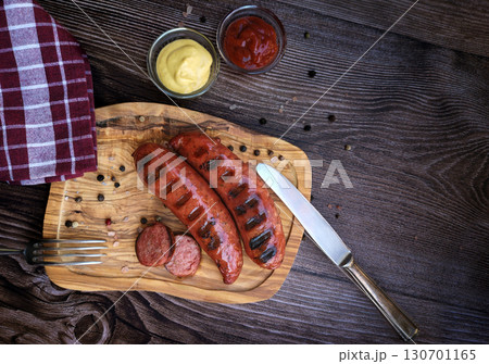 Delicious grilled pork sausages on wooden table Delicious grilled pork sausages on wooden table 130701165