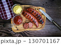 Delicious roasted wurst sausages on wooden  table 130701167