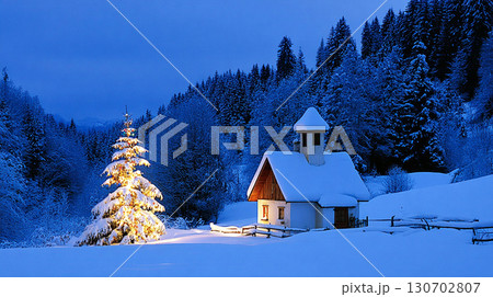 Cozy Winter Night with Illuminated Christmas Tree and Snow Covered Cabin in Forest 130702807