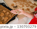 A young girl is cooking homemade Christmas cookies in the kitchen. 130703279