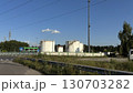 Modern gas station with fuel pumps outdoors, service area for vehicles and refueling 130703282