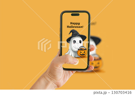 A Halloween ghost illustration on an orange background, captured with a mobile phone. 130703416