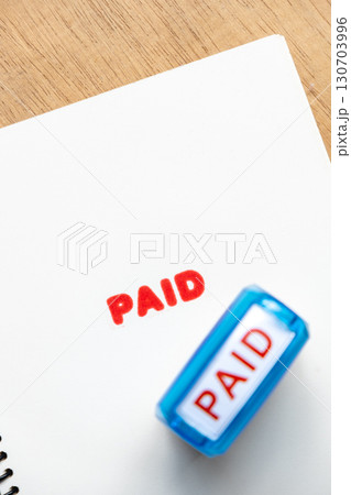 Financial Concept with Paid Stamp on Paper Document Financial Concept with Paid Stamp on Paper Document 130703996