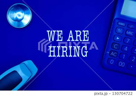 "We are hiring" text flat lay on the office workplace 130704722