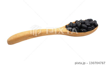 Side view of wooden spoon filled with black beans isolated on white background, suitable for concepts of organic food 130704787