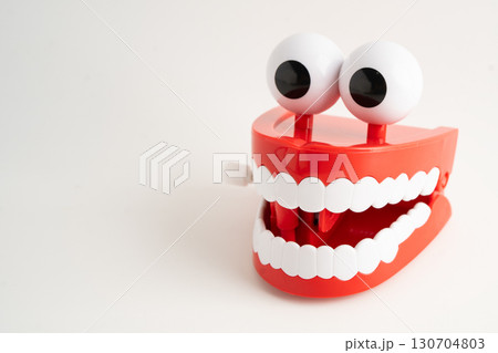 Funny red teeth with eye toy denture model for dental health care. Funny red teeth with eye toy denture model for dental health care. 130704803