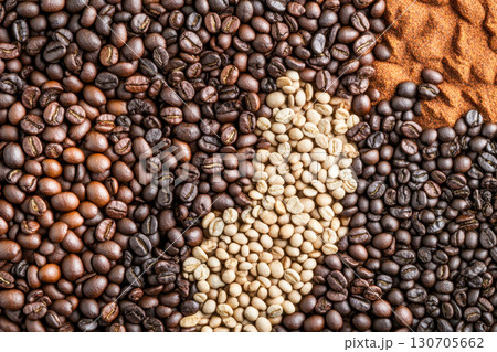 Various coffee beans and ground powder. Close up top view showing different roast levels: green, light, medium, dark. Perfect rich texture background. 130705662