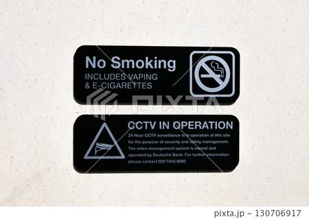 No Smoking and CCTV in Operation warning signs on wall for security and safety No Smoking and CCTV in Operation warning signs on wall for security and safety 130706917