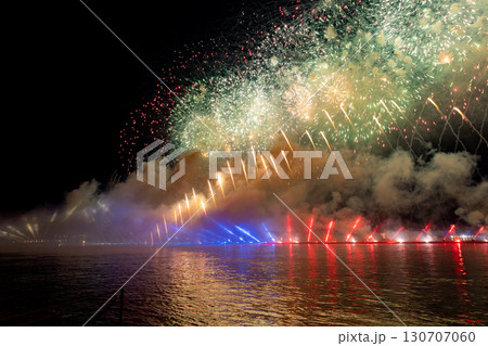 Festive colorful fireworks and illumination in dark sky with beautiful reflection in water. Holiday SCARLET SAILS. High quality photo Festive colorful fireworks and illumination in dark sky with beautiful reflection in water. Holiday SCARLET SAILS. High quality photo 130707060