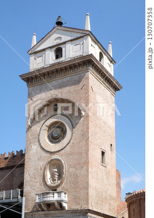 Clock tower of Palace of Reason (Palazzo della Ragione with the Torre dell'Orologio) in Mantua, Italy 130707358