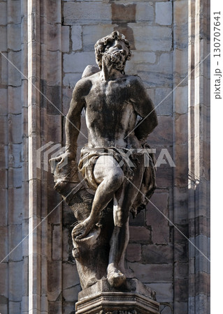 Statue of Saint on the facade of the Milan Cathedral, Duomo di Santa Maria Nascente, Milan, Lombardy, Italy Statue of Saint on the facade of the Milan Cathedral, Duomo di Santa Maria Nascente, Milan, Lombardy, Italy 130707641
