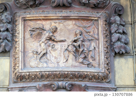 Relief of Annunciation scene on the house facade in Bologna, Italy Relief of Annunciation scene on the house facade in Bologna, Italy 130707886