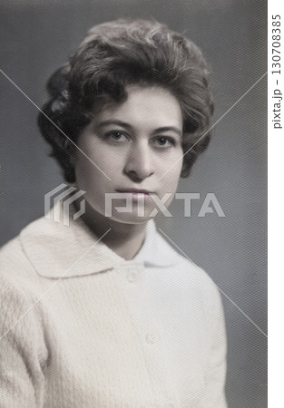 Vintage portrait of a young beautiful woman with a fashionable hairstyle in the 1960s. Retro photo 1965. Vintage portrait of a young beautiful woman with a fashionable hairstyle in the 1960s. Retro photo 1965. 130708385