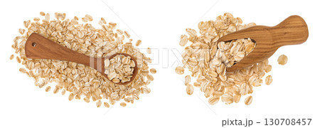Oat flakes in wooden spoon and scoop isolated on white background with full depth of field. Top view. Flat lay Oat flakes in wooden spoon and scoop isolated on white background with full depth of field. Top view. Flat lay 130708457
