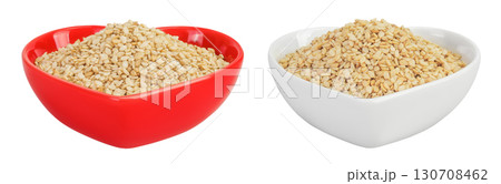 Sesame seeds in ceramic bowl isolated on white background with full depth of field Sesame seeds in ceramic bowl isolated on white background with full depth of field 130708462