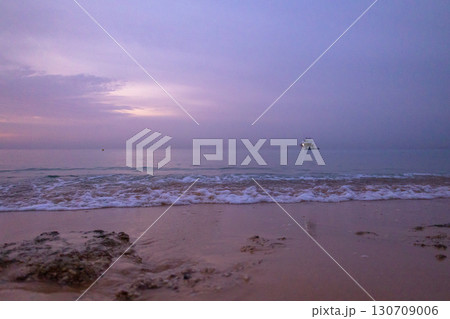 Aerial view to calm sea, sandy beach with rocky coastline. Beautiful sunrise of sun above horizont in summer morning, Sharm El Sheikh, Egypt. Vacation, holiday concept. High quality photo Aerial view to calm sea, sandy beach with rocky coastline. Beautiful sunrise of sun above horizont in summer morning, Sharm El Sheikh, Egypt. Vacation, holiday concept. High quality photo 130709006