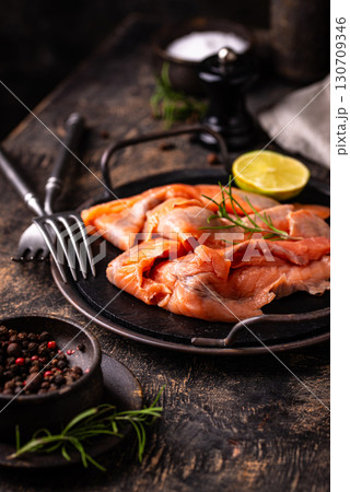Salted sliced salmon fish with herbs Salted sliced salmon fish with herbs 130709346