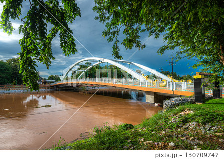Chan Palace Bridge over the Nan River rises Chan Palace bridge blue sky background New Landmark It is a major tourist is Public places attraction Phitsanulok at daytime Chan Palace Bridge over the Nan River rises Chan Palace bridge blue sky background New Landmark It is a major tourist is Public places attraction Phitsanulok at daytime 130709747