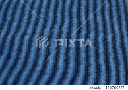 Blue textured fabric with fine vertical lines in detailed close-up view Blue textured fabric with fine vertical lines in detailed close-up view 130709875