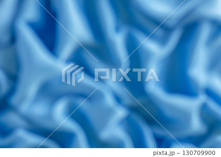 Abstract close-up of blue textile folds with soft lighting 130709900