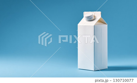 A plain white gable top carton with a white screw-top lid against a simple blue background.  Minimalist. Clean. Fresh. Neutral packaging. Generic brand. 130710077