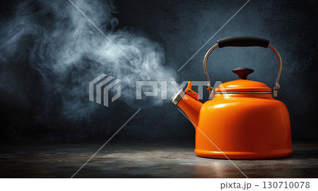 A vibrant orange kettle is releasing steam, creating a dynamic contrast against a dark, textured backdrop.  The scene conveys warmth and anticipation. 130710078