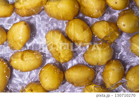Fresh Organic Potatoes Immersed In Water With Splashing Effect. 130710270