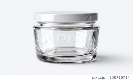 A simple glass jar with a white lid, isolated against a white background, showcasing its clean and modern design for cosmetics or food storage. 130710714