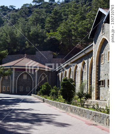 The monastery's historic stone buildings with arched windows and red-tiled roofs 130710765