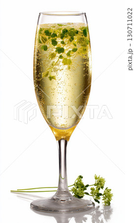 Sparkling champagne with green herb garnish in tall flute glass 130711022