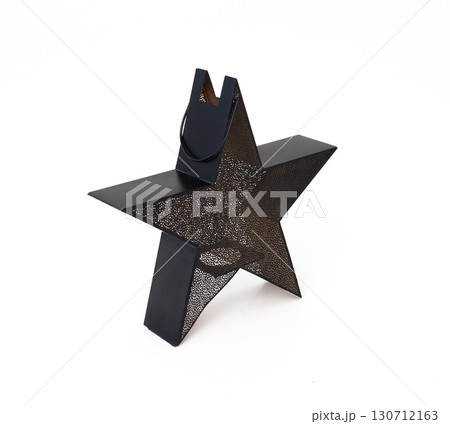 star-shaped lantern with intricate, perforated patterns, perfect for creating a cozy, decorative ambiance. 130712163