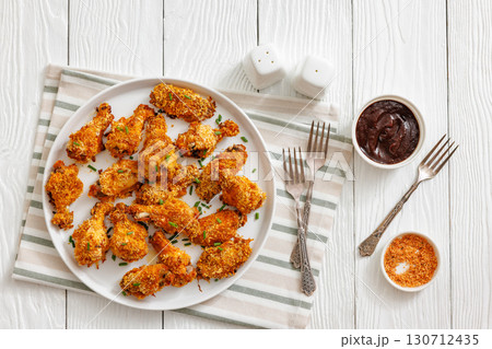 Panko breaded oven baked chicken wings on plate 130712435
