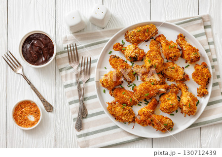 Panko breaded oven baked chicken wings on plate 130712439