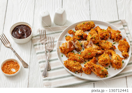 Panko breaded oven baked chicken wings on plate 130712441