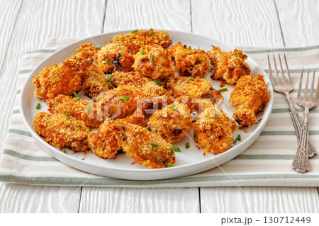 Panko breaded oven baked chicken wings on plate Panko breaded oven baked chicken wings on plate 130712449